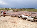 EF5 damage example--These tornadoes cause complete destruction, obliterating and sweeping away almost anything in their paths, including those sheltering in open basements, sending any vehicles or trains flying through the air, and causing tall buildings to collapse or to have severe structural deformations.