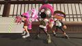 Inklings and an Octoling shaking a Fizzy Bomb